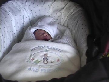 In pram before first public outing.